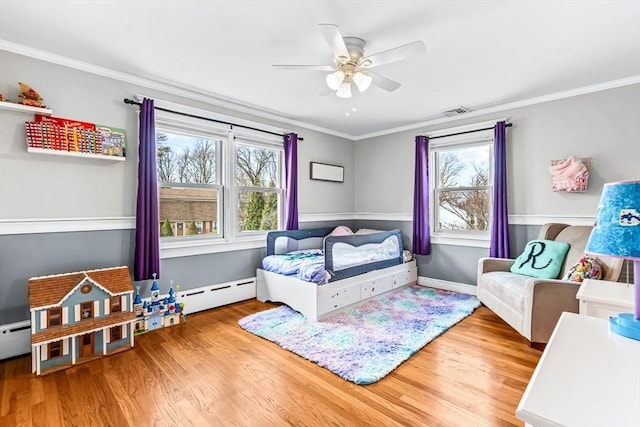 40 Chase Rd, Marlborough, MA 01752 - bedroom featuring a baseboard radiator, wood finished floors, crown molding, and ceiling fan