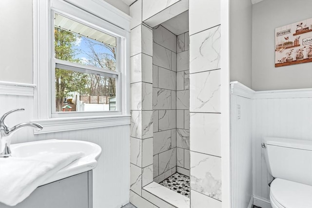 40 Chase Rd, Marlborough, MA 01752 - bathroom with wainscoting, tiled shower, vanity, and a decorative wall