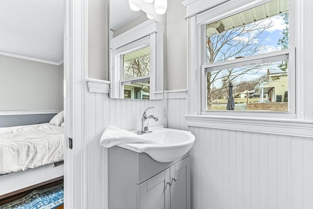 40 Chase Rd, Marlborough, MA 01752 - ensuite bathroom featuring a wainscoted wall, vanity, and ornamental molding