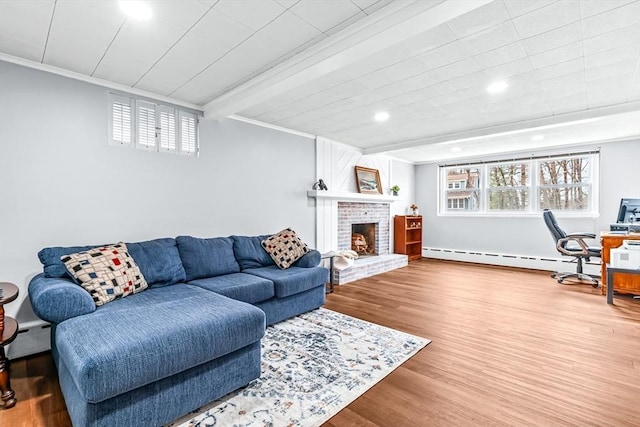 40 Chase Rd, Marlborough, MA 01752 - living room with baseboard heating, wood finished floors, crown molding, recessed lighting, and a brick fireplace