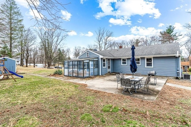 40 Chase Rd, Marlborough, MA 01752 - rear view of property with a sunroom, a patio area, a yard, a chimney, and roof with shingles