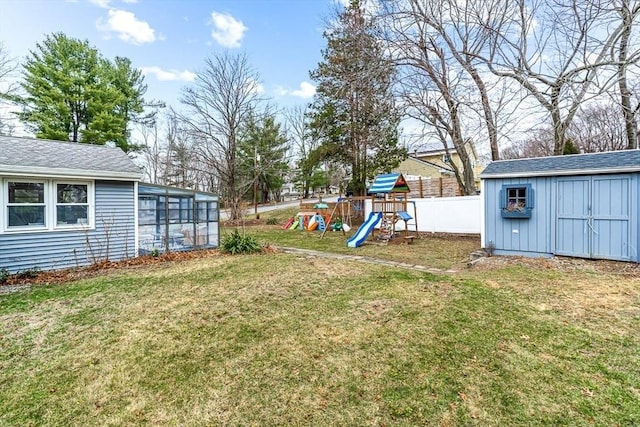 40 Chase Rd, Marlborough, MA 01752 - view of yard with a playground, a storage unit, and a sunroom