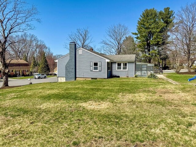 40 Chase Rd, Marlborough, MA 01752 - rear view of property featuring a chimney and a yard