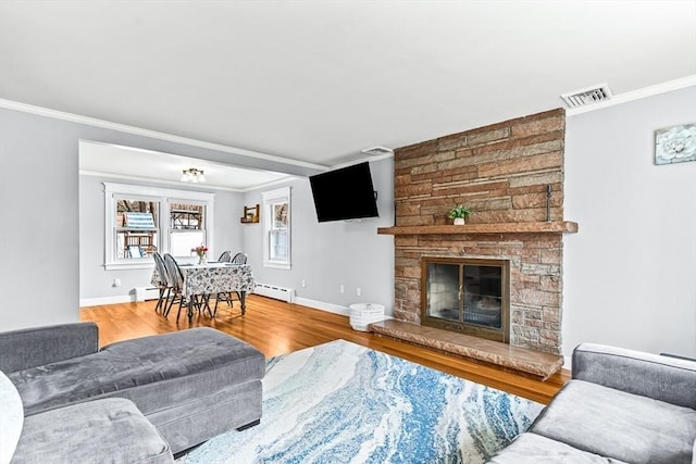 40 Chase Rd, Marlborough, MA 01752 - living area with crown molding, wood finished floors, and a stone fireplace