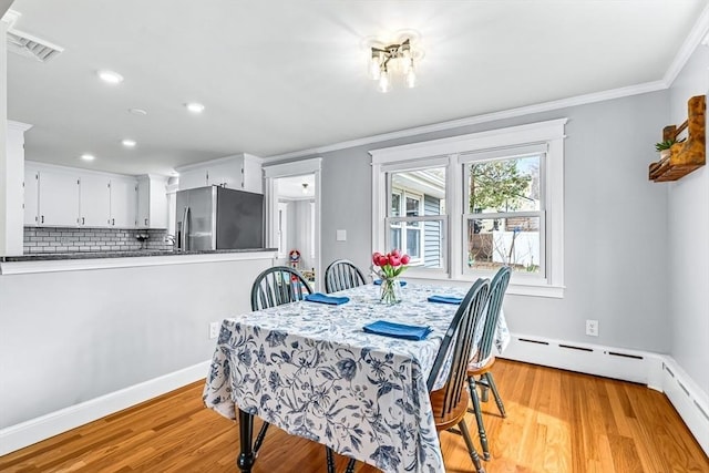 40 Chase Rd, Marlborough, MA 01752 - dining room with light wood-style flooring, crown molding, recessed lighting, and a baseboard radiator