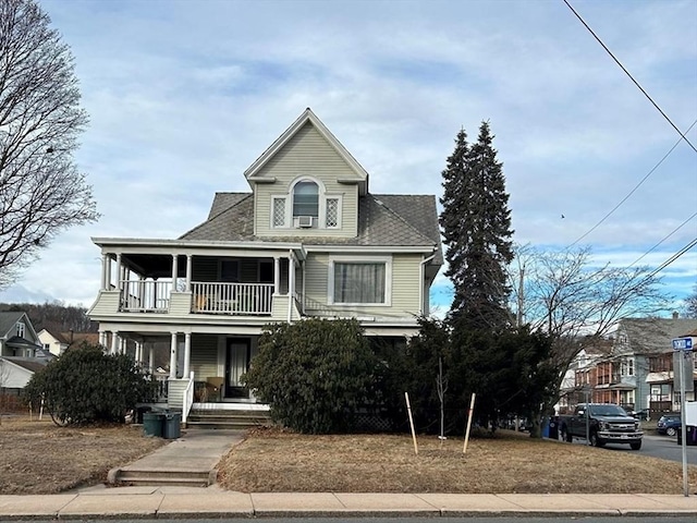 view of front of house with a balcony and a porch