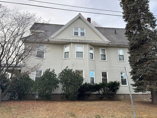 view of side of home featuring a lawn