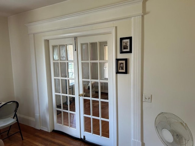 doorway to outside featuring french doors and dark wood-type flooring