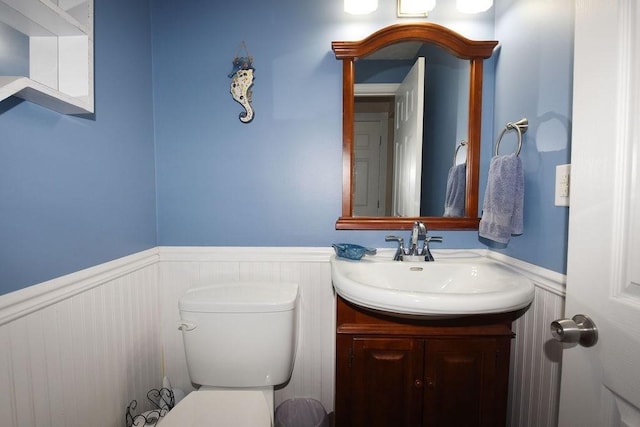 9 Lydon Ln Unit D2, Halifax, MA 02338 - bathroom with a wainscoted wall, toilet, and vanity