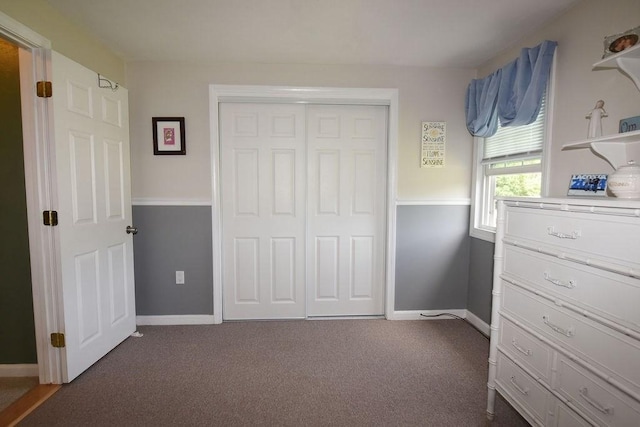 9 Lydon Ln Unit D2, Halifax, MA 02338 - bedroom featuring dark carpet, a closet, and baseboards
