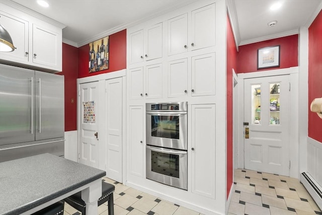 104 Main St, Topsfield, MA 01983 - kitchen featuring appliances with stainless steel finishes, a baseboard radiator, light floors, ornamental molding, and white cabinetry