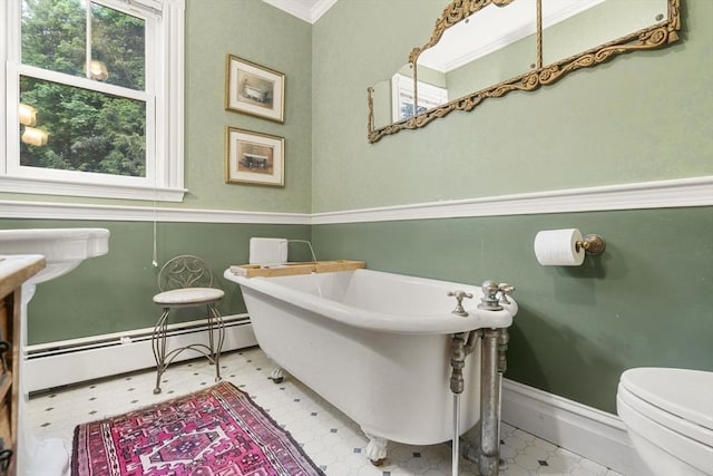 104 Main St, Topsfield, MA 01983 - bathroom with tile patterned floors, plenty of natural light, a soaking tub, a baseboard radiator, and crown molding