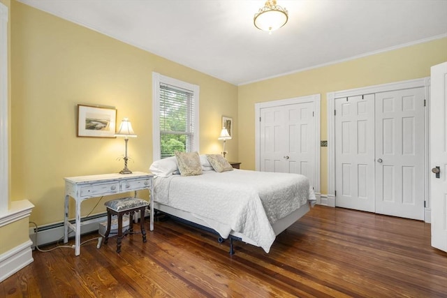 104 Main St, Topsfield, MA 01983 - bedroom featuring two closets, wood finished floors, baseboard heating, and baseboards