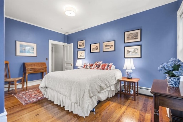 104 Main St, Topsfield, MA 01983 - bedroom with wood finished floors, ornamental molding, baseboards, and a baseboard heating unit