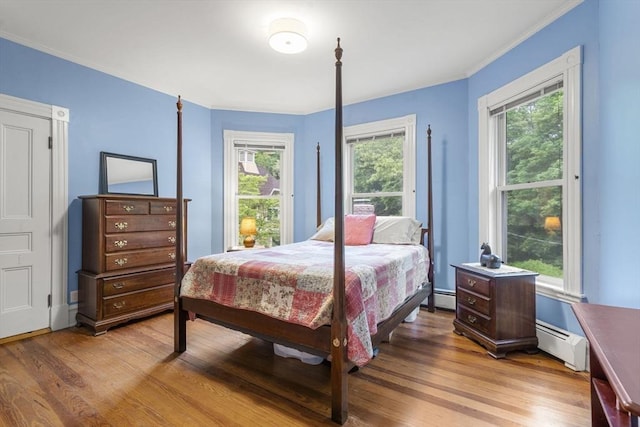 104 Main St, Topsfield, MA 01983 - bedroom featuring a baseboard radiator, light wood-style floors, and ornamental molding