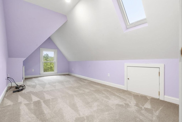 104 Main St, Topsfield, MA 01983 - additional living space with light colored carpet, baseboards, lofted ceiling, and a skylight