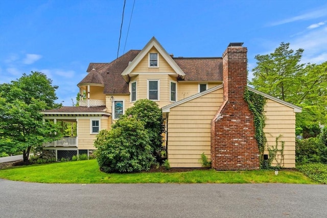 104 Main St, Topsfield, MA 01983 - view of front facade featuring a chimney, a front lawn, and a shingled roof