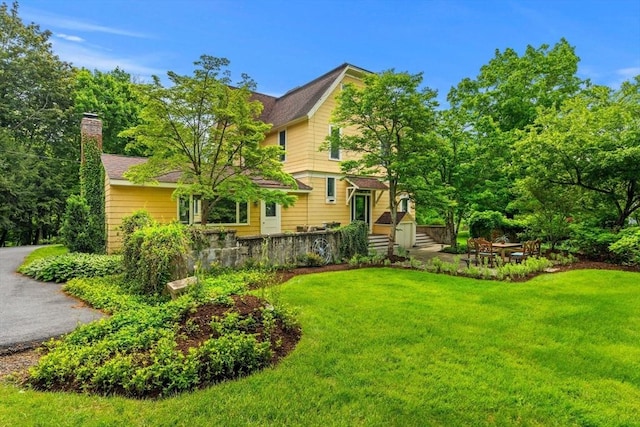 104 Main St, Topsfield, MA 01983 - view of front of home with a front lawn and a chimney