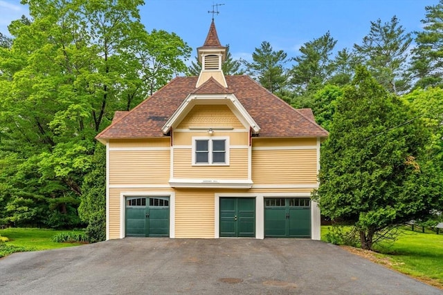 104 Main St, Topsfield, MA 01983 - view of property exterior with driveway, an attached garage, a shingled roof, and a lawn