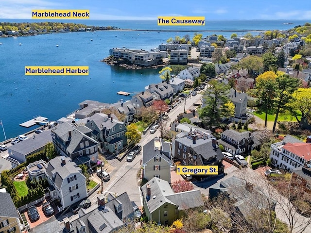 bird's eye view featuring a water view and a residential view
