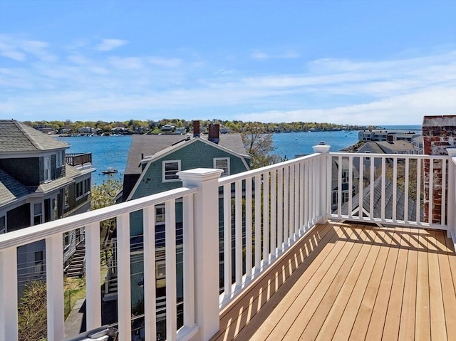 wooden deck with a water view