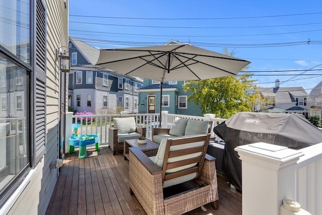 wooden deck featuring an outdoor hangout area
