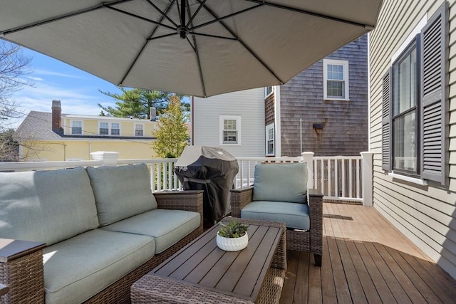wooden deck featuring an outdoor hangout area