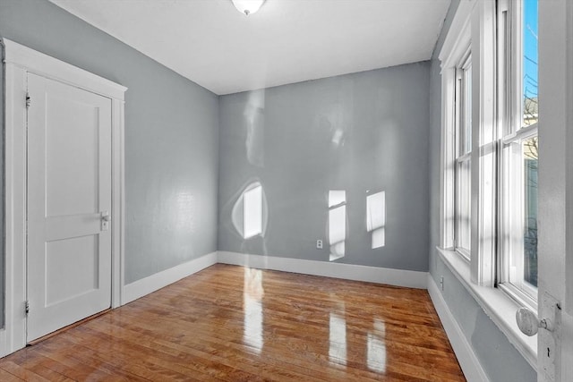 unfurnished room with light hardwood / wood-style flooring