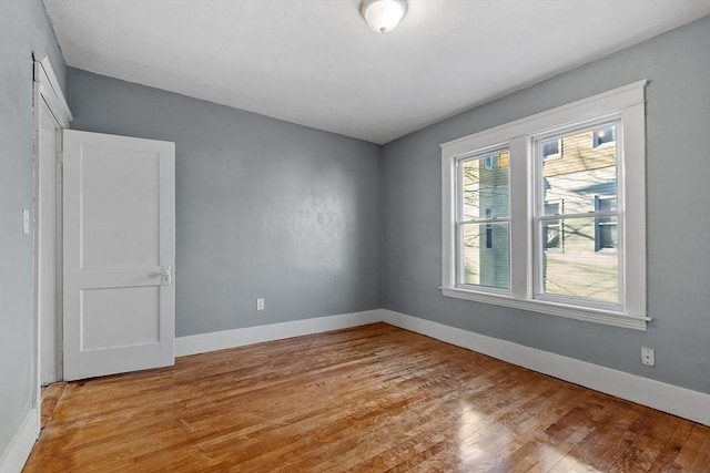 unfurnished room featuring light hardwood / wood-style flooring