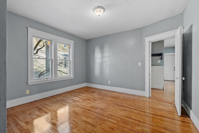 spare room featuring hardwood / wood-style floors