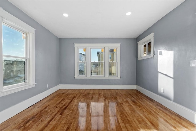 spare room with light hardwood / wood-style floors