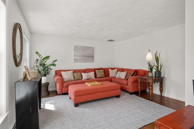 32 Iverson Rd, Beverly, MA 01915 - living room featuring wood finished floors, baseboards, and a baseboard heating unit