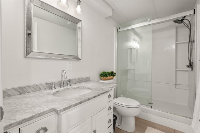 32 Iverson Rd, Beverly, MA 01915 - full bathroom with a stall shower, toilet, vanity, and wood finished floors