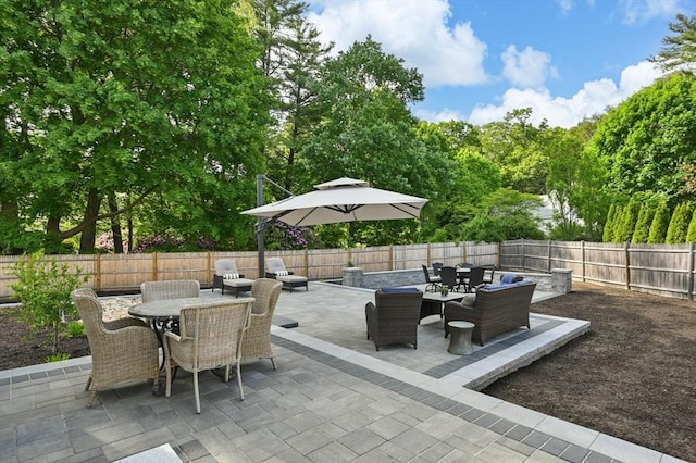 32 Iverson Rd, Beverly, MA 01915 - fenced backyard featuring outdoor dining space, a patio, and an outdoor hangout area