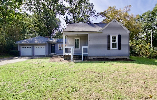 view of front of home featuring a garage, covered porch, and a front yard