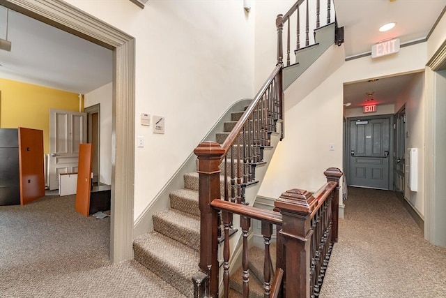 37 Mellen St, Cambridge, MA 02138 - staircase featuring carpet flooring