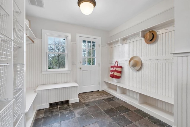 mudroom featuring visible vents and stone finish flooring