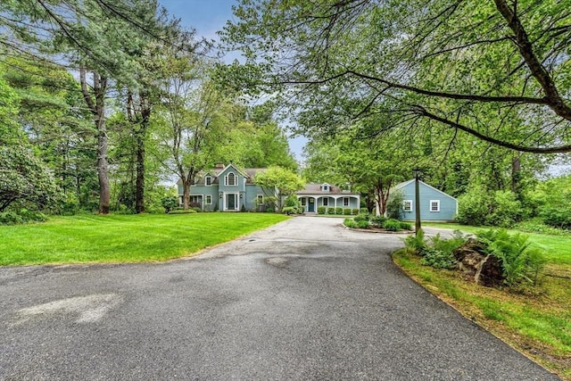 1731 Lowell Rd, Concord, MA 01742 - view of front of house featuring asphalt driveway and a front lawn
