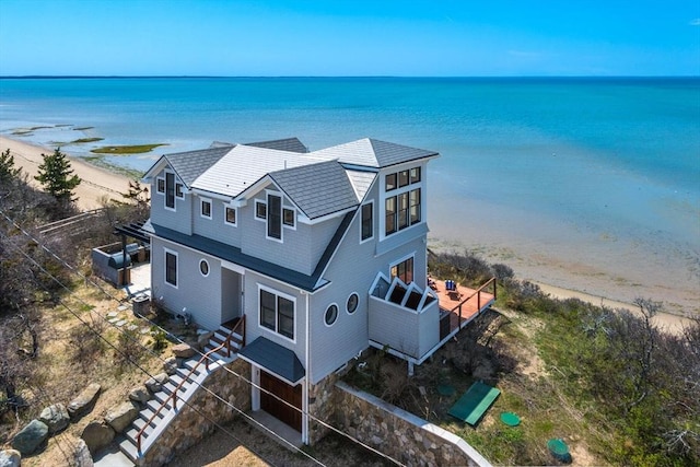 bird's eye view with a water view and a view of the beach