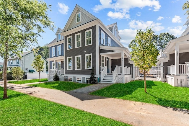 view of front facade with a front lawn and a porch