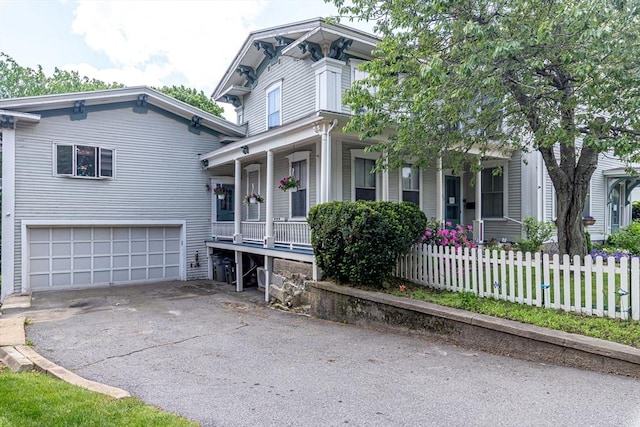 52 Central, Gardner, MA 01440 - italianate house with covered porch, an attached garage, and driveway