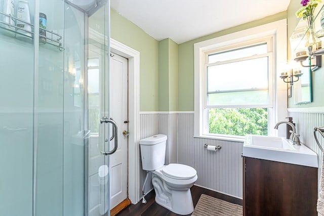 52 Central, Gardner, MA 01440 - full bathroom featuring wainscoting, wood finished floors, vanity, toilet, and a stall shower