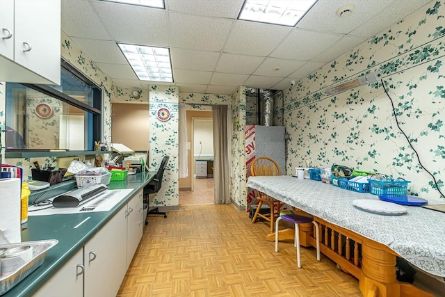 52 Central, Gardner, MA 01440 - kitchen featuring wallpapered walls, white cabinetry, and a paneled ceiling