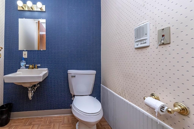 52 Central, Gardner, MA 01440 - half bath featuring toilet, a sink, and baseboards