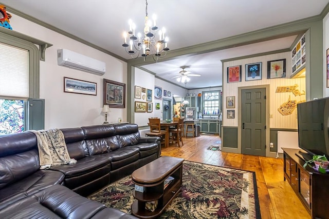 52 Central, Gardner, MA 01440 - living area with a wall mounted AC, crown molding, a chandelier, light wood-style flooring, and ceiling fan
