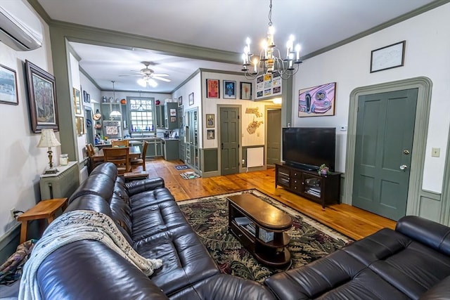52 Central, Gardner, MA 01440 - living area with crown molding, wood-type flooring, a chandelier, an AC wall unit, and ceiling fan