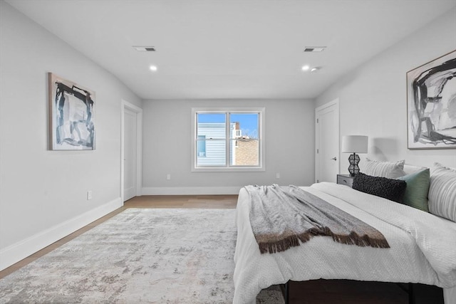 bedroom with wood-type flooring