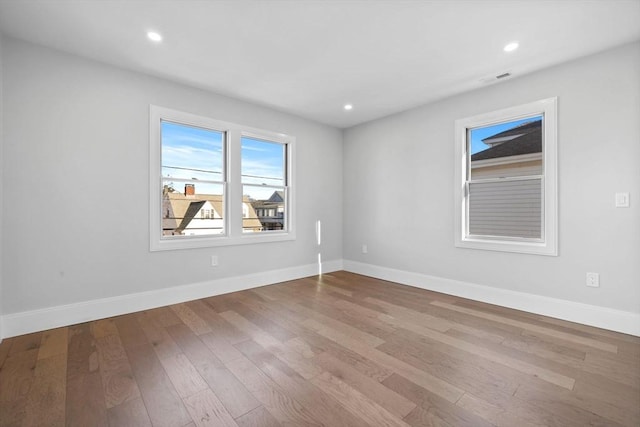 unfurnished room featuring light wood-type flooring