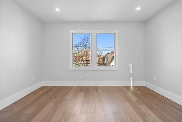 spare room with light wood-type flooring