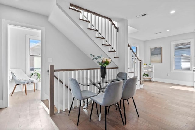 dining space featuring light hardwood / wood-style floors